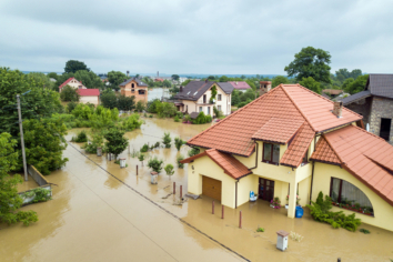 Aerial view of flooded houses with dirty water