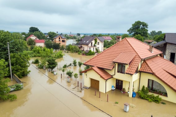 Aerial view of flooded houses with dirty water