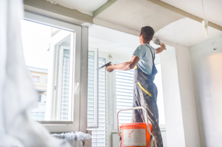 A man plastering a house